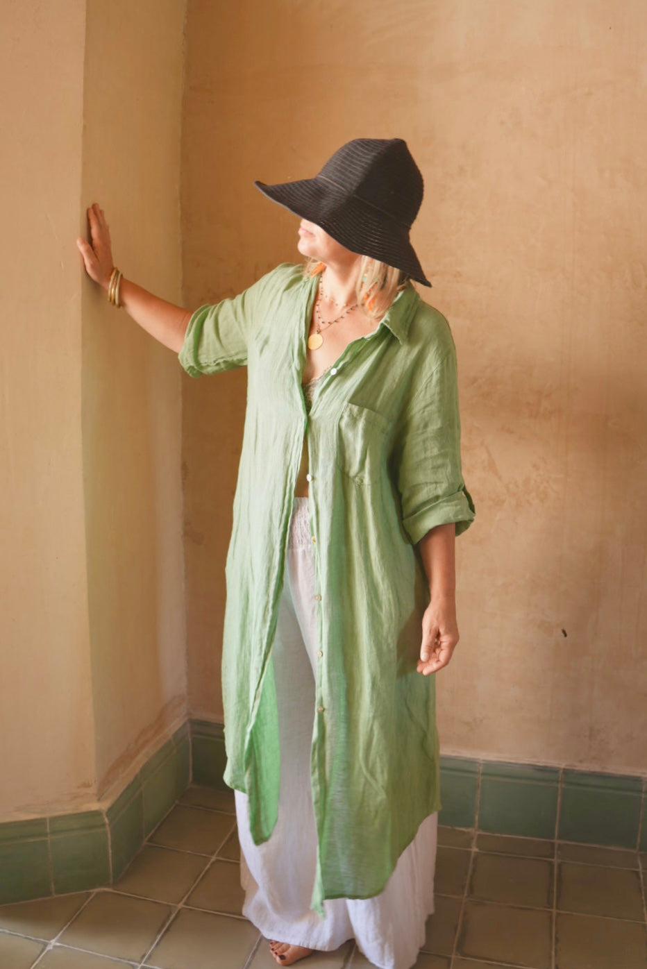 Merida Linen Shirt Dress in Sage green styled open over white pants